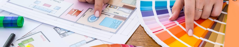 Female hands choosing colour for bedroom walls